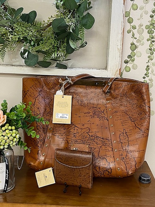Patricia Nash large brown leather map bag with matching wallet.